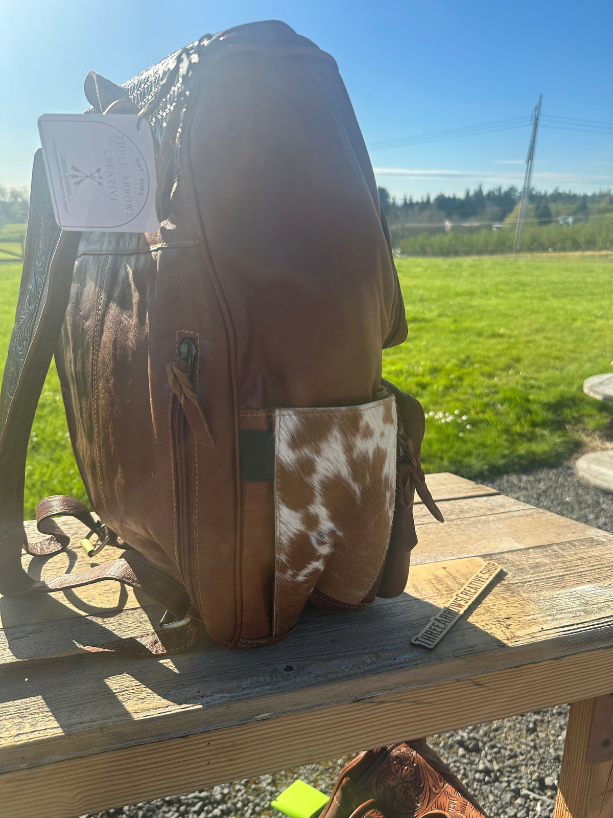 Leather and Cowhide Backpack with Praying Cowboy