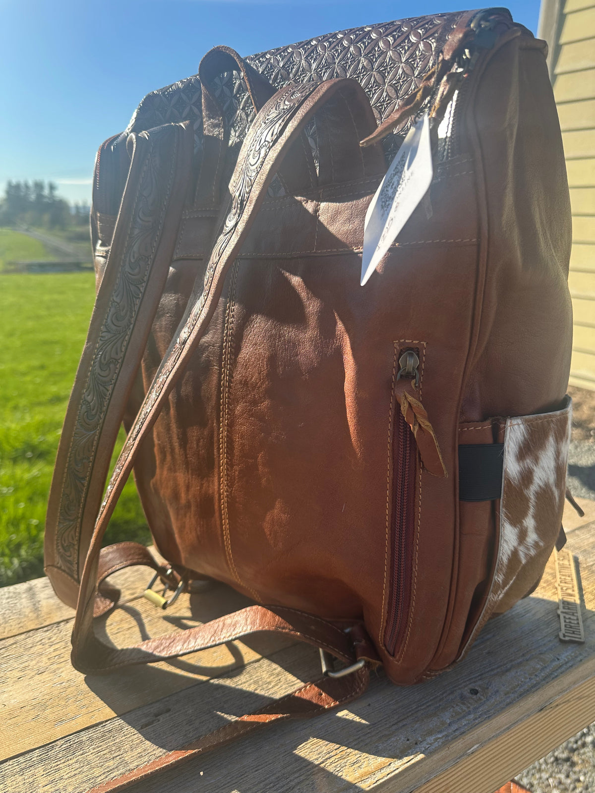 Leather and Cowhide Backpack with Praying Cowboy
